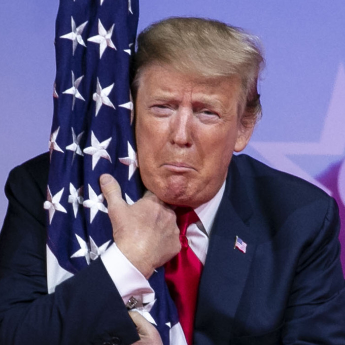 02-CPAC-Trump-Hugs-Flag.w700.h700
